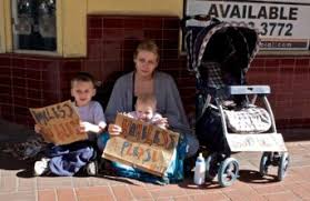 A family experiencing homelessness on a Washington DC sidewalk